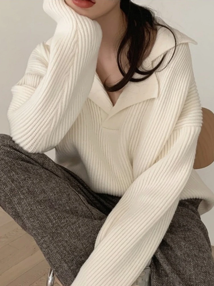 

Design sense of wind outside to wear 2023 autumn and winter new Japan and South Korea lazy lapel sweater sweater woman