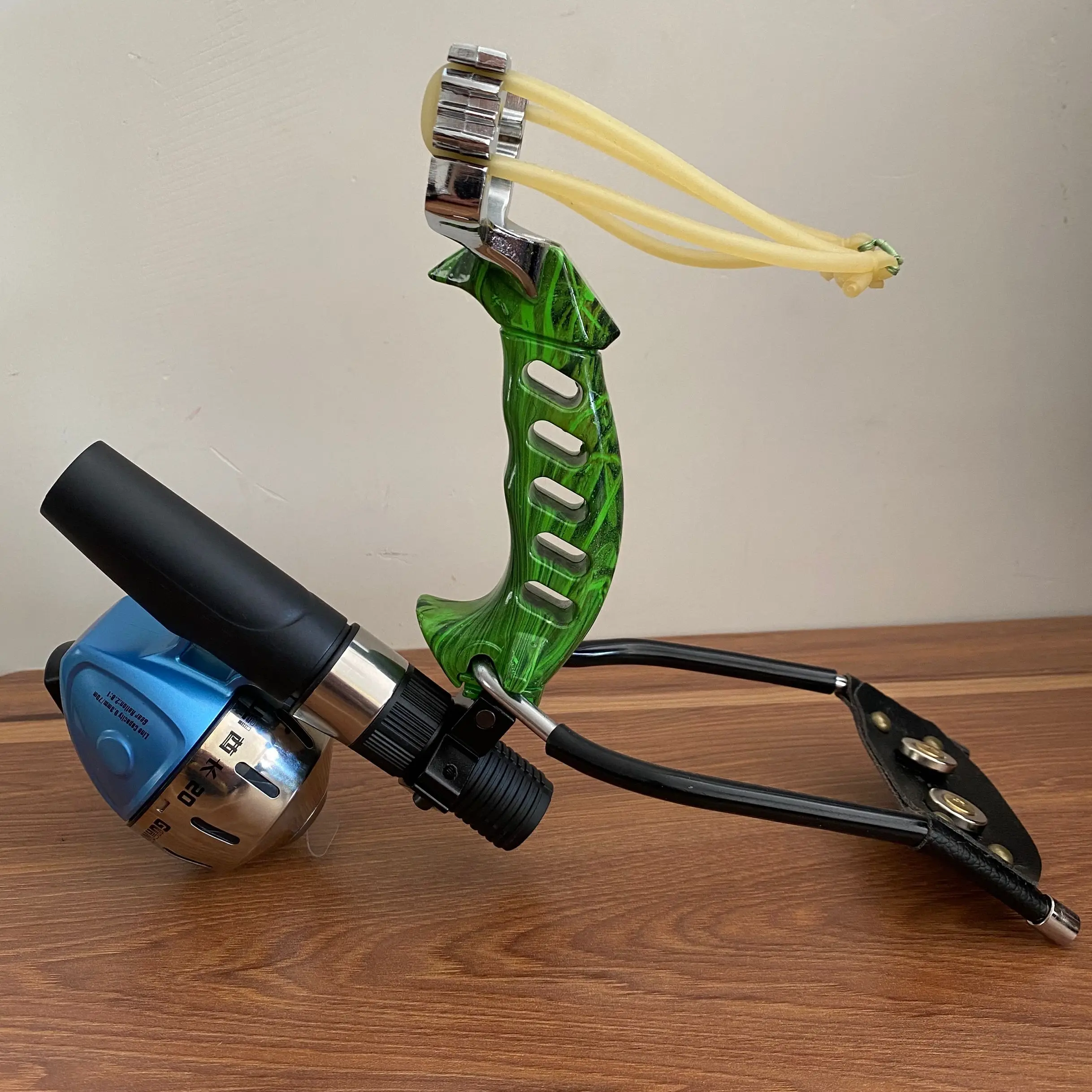 

Powerful Hunting Slingshot With Wrist Fishing Sling Rest For Outdoor Shooting Professional Metal Slingshot Catapult Catch Fish
