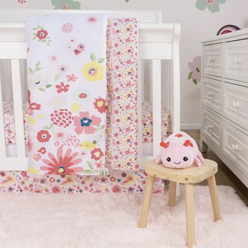 

Sammy And Lou Floral Sprinkles 4 Piece Crib Bedding Set. Floral Scatter Print In Pink, White, Yellow, Teal, And Green.