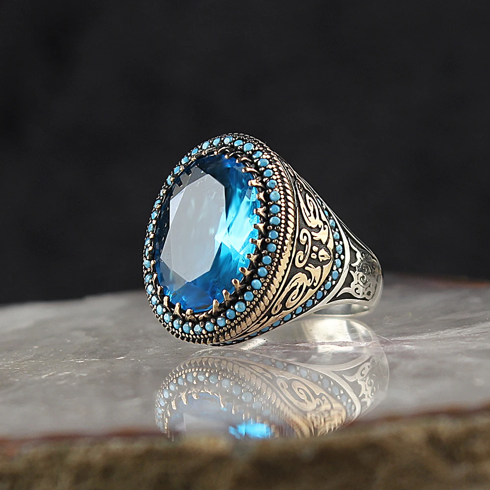 

Мужское кольцо из серебра 925 пробы с круглым голубым топазом, ограненным кристаллом