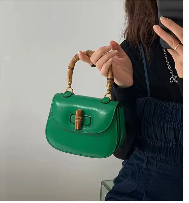 2023 new women's bags trendy fashion handbag shoulder cross bag bamboo section lock retro saddlebag niche bag