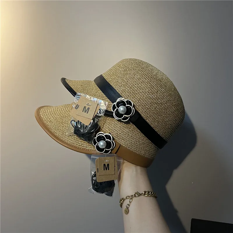 

202202-2509264 new summer plant fiber grass pu ribbon camellia alloy flower leisure baseball Equestrian hat women visors cap