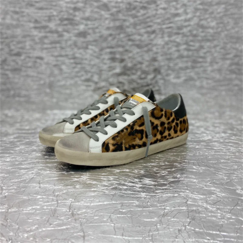 

The new soft calfskin sneakers are decorated with avantgarde leopard print rubber soles, which are hand worn. They are ideal for
