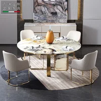 Italian luxury round dining table stainless steel rock plate modern simple dining table chair combination