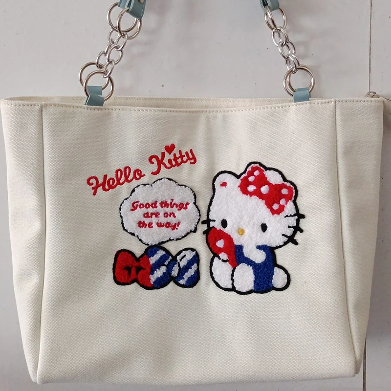

Холщовая Сумка-тоут с вышивкой Hello Kitty для женщин, мультяшный саквояж на плечо, милая сумочка для хранения косметики в форме сердца для девуш...