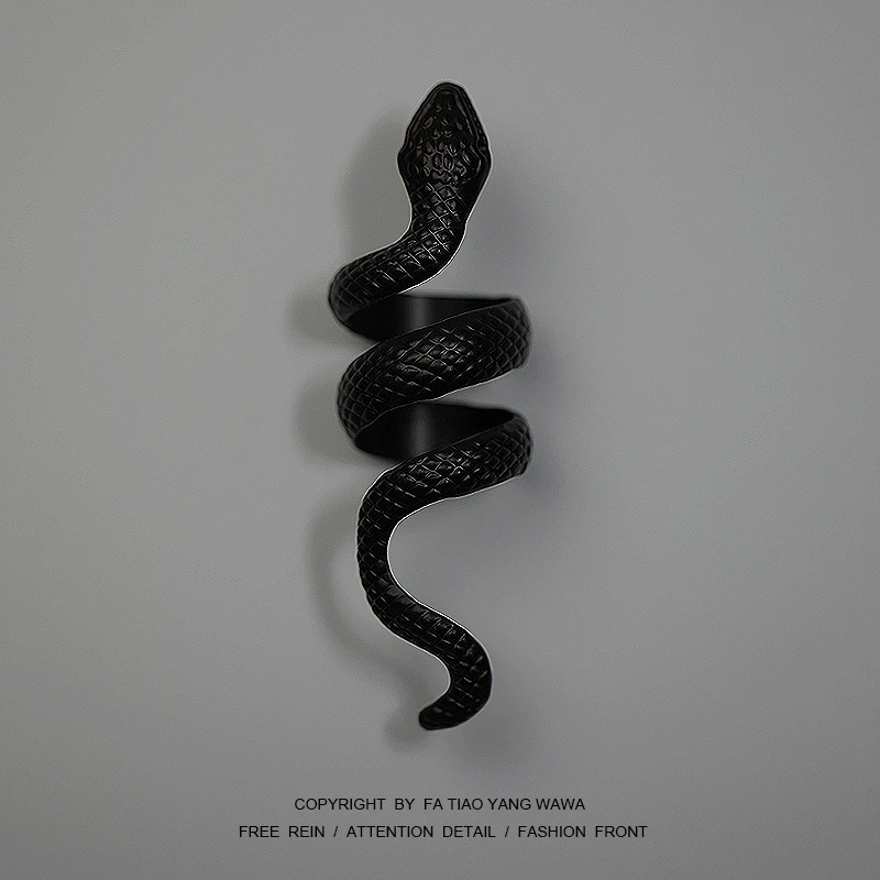 

Multi-tiered snake black ring
