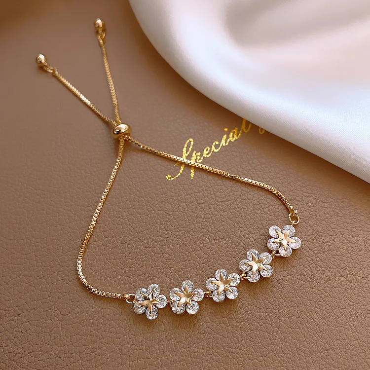 

Elegant rhinestone studded bracelet with golden flower charm bracelet Women's fashion jewelry accessories party gift charm