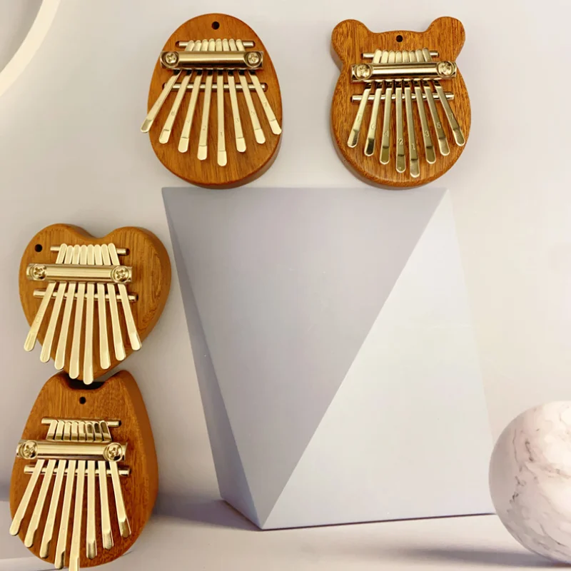 8-тоновая мини-пластина для пианино большого пальца фотография