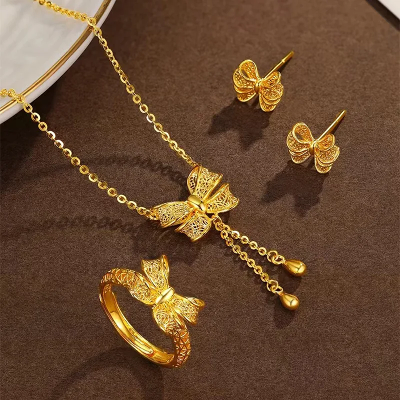 

Bow Knot Necklace Hollow out Bow Knot Earrings Ring Plating 18K Gold Fairy Three Piece Set for Girlfriend's Birthday Party Gift