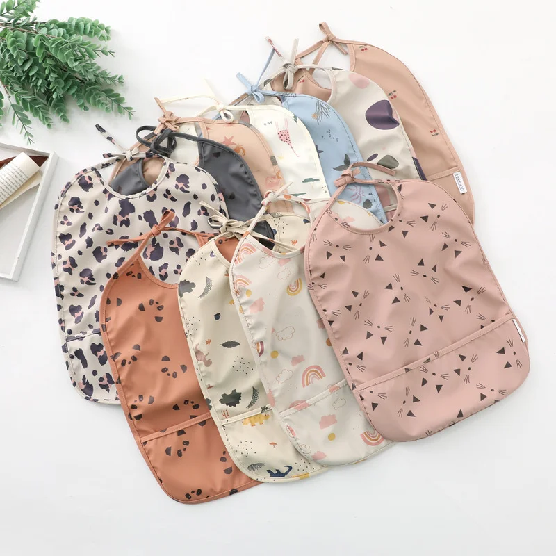 

Infant Sleeveless Bib with Pocket Baby Stuff Children Accessories Feeding Drawing Apron Waterproof Adjustable Cute Print Bibs