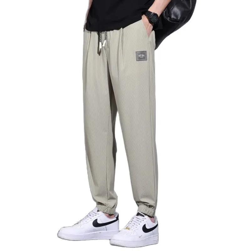 

Spring and Summer New Men's Thin Casual Harlan Pants Ice Silk Elastic Waist Vertical Stripe Pants Male Brand