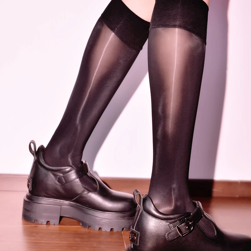 

Glossy socks women socks black stockings women thin summer anti-slip long tube cool silky mirror jk calf socks.