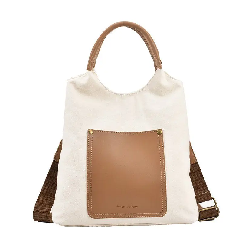 

2023 new small korea portable artistic canvas bag women's messenger bag special-interest design stitching tote bag shoulder bag