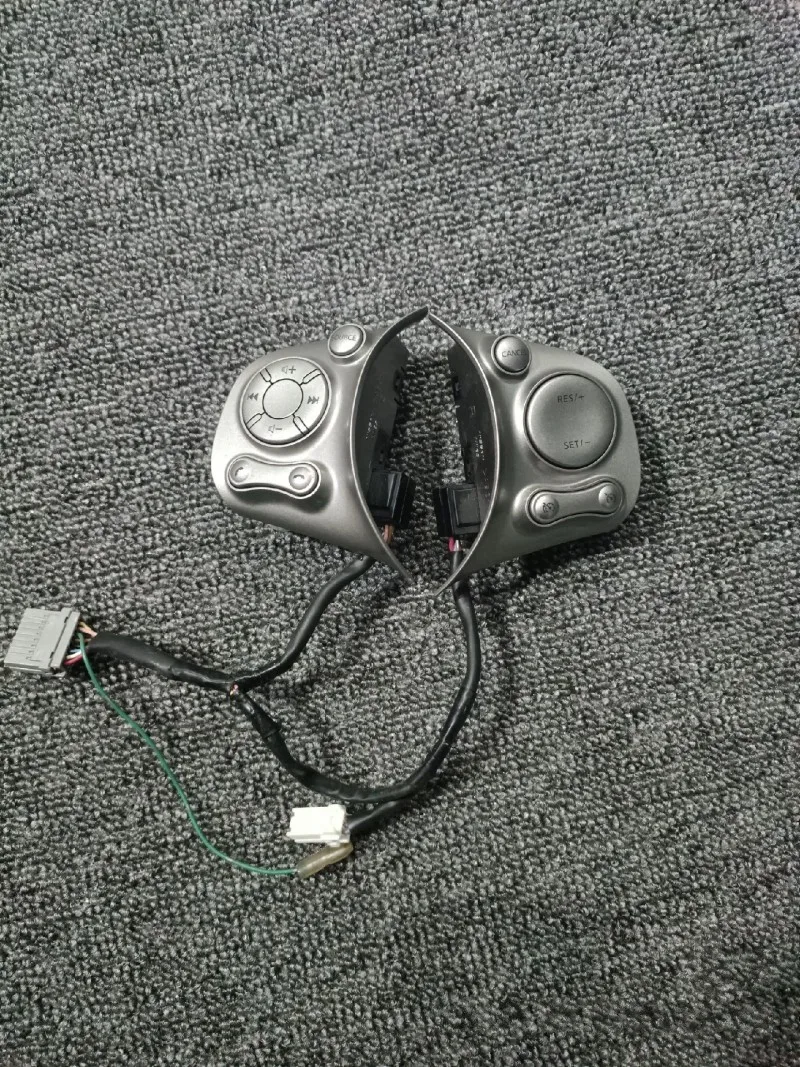 

Оригинальный б/у (б/у) многофункциональный переключатель круиз-контроля на руле для Nissan Sunny/March 2011-2015