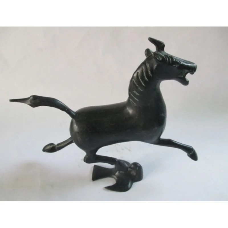 

Ancient Chinese bronze statue. The horse stepped the swallow