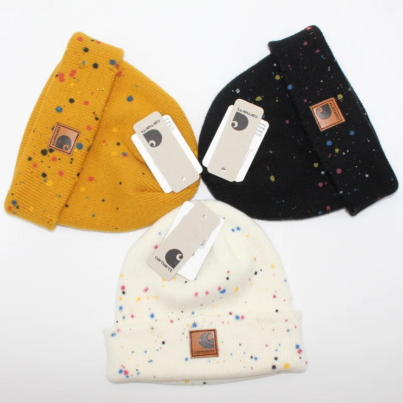 

2021 new spray painted hole leather label double-layer warm wool hat men's and women's damp cold hat brimless hip-hop knit hat