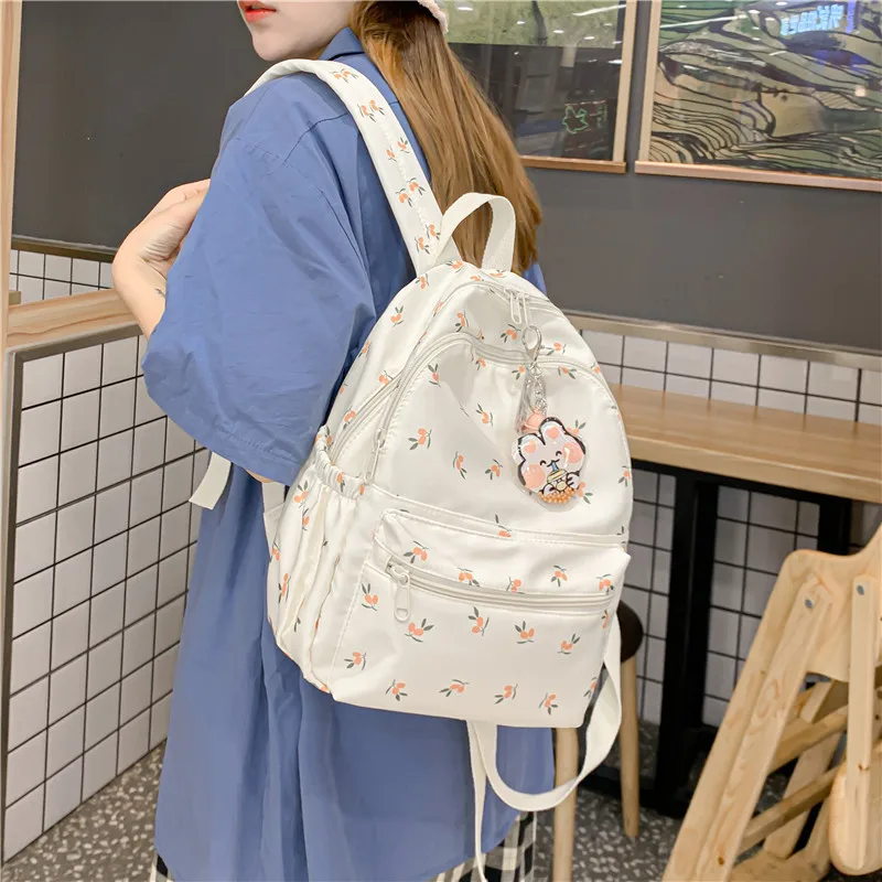 

2022 summer new Korean version street trend student nylon schoolbag fashion small flower casual couple backpack