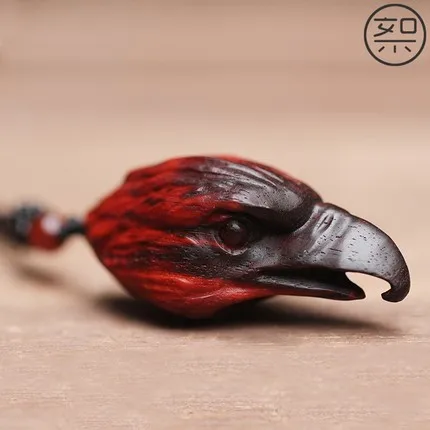 Delicate small leaf rosewood eagle head pendant