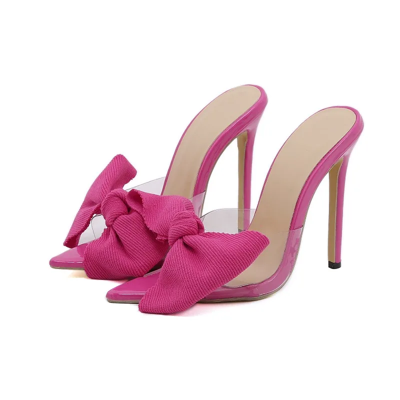 Женские босоножки на очень высоком каблуке с острым носком и съемными бантами.