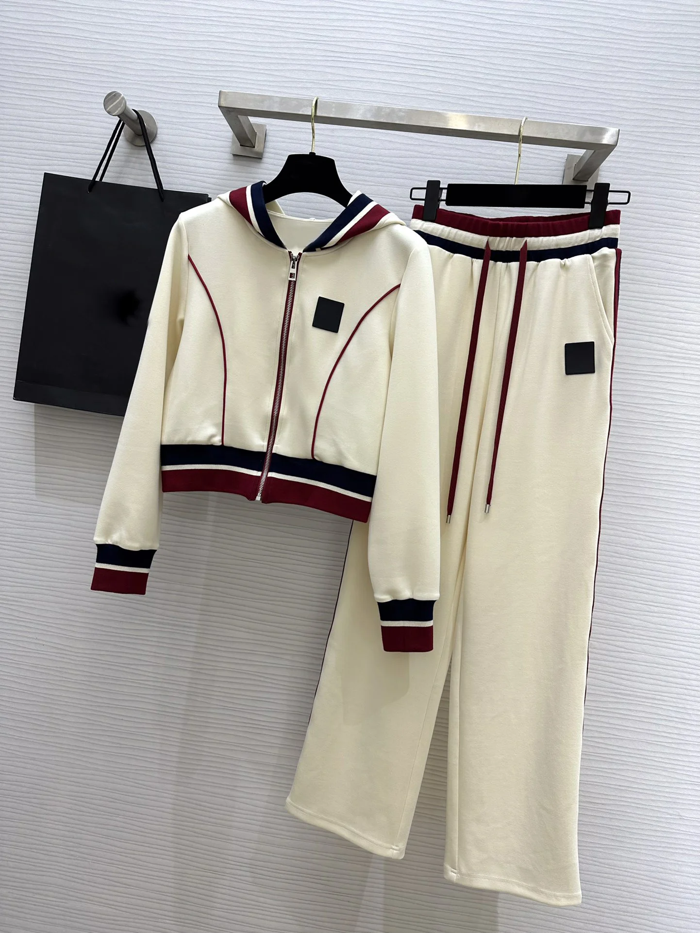 

2023Embossed leather embellish tracksuit, short loose hoodie and elasticated straight-leg slacks9.10