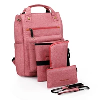 versatile diaper bag backpack with hidden shoulder straps and tons of pockets