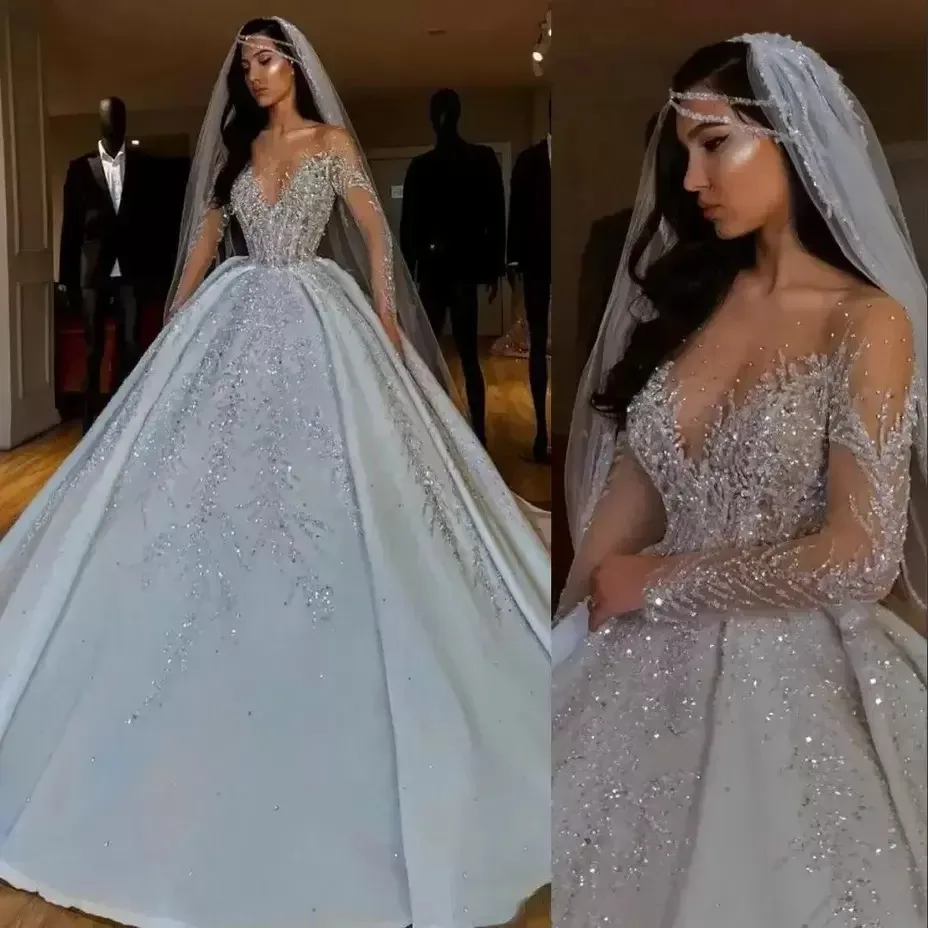 

Dubai Arabic Luxury A Line Wedding Formal Bride Dress JeweL Neck Illusion Sheer Crystal Beading Long Sleeves Satin Backl