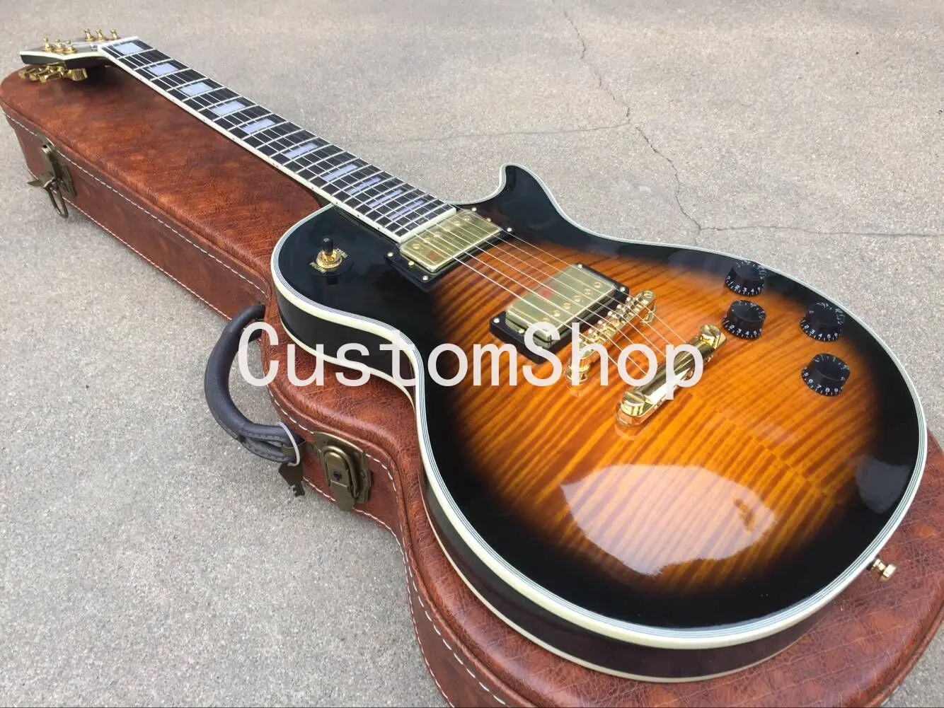 

Flame Maple Top Amber Sunburst Electric Guitar 5 Ply Body binding Rosewood Fingerboard Trapezoid White Mother of Pearl Inlay