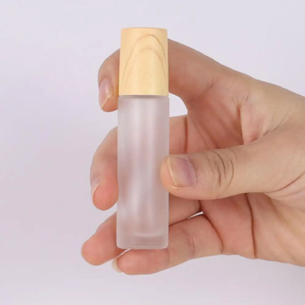 

5 Pcs/Set Roll On Bottle Space-saving Anti-deformed with Wood Grain Lid Smooth Ball Cosmetic Vials for Travel