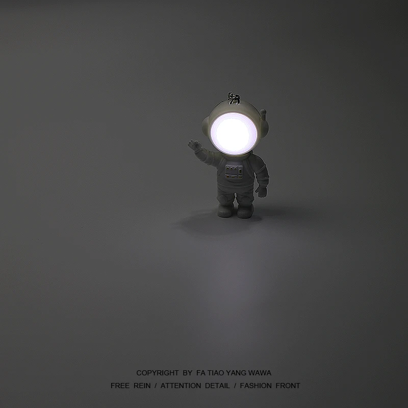 

Bored look at the astronaut saying hello to you! Can shine! Key chain