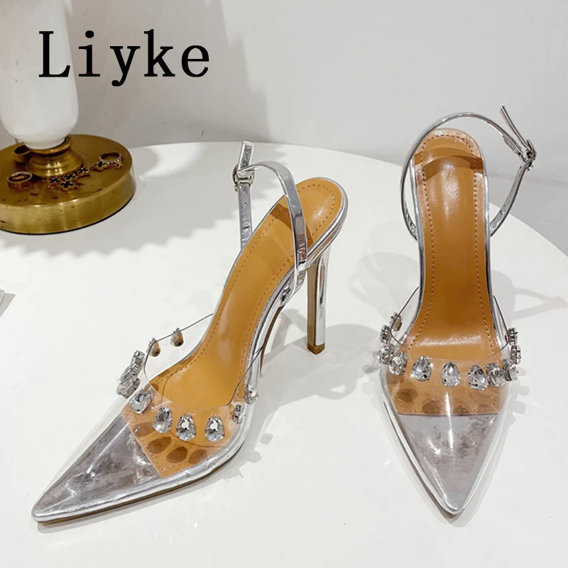 

Новые прозрачные женские туфли-лодочки Liyke из ПВХ, пикантные Стразы с кристаллами, с заклепками, на высоком каблуке, с острым носком, свадебн...