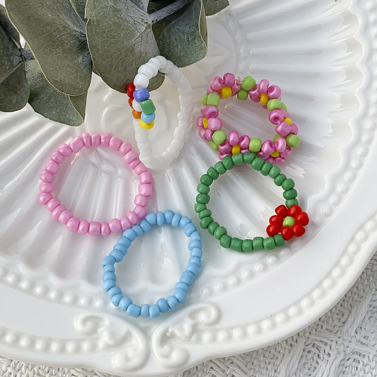 

Woven colorful flower daisy ring hand decorated with rice beads hand ring