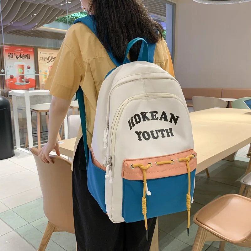 

2023 Spring New Contrast Letter Large Capacity Backpack Fashion Joint Trend Student Backpack for Men and Women