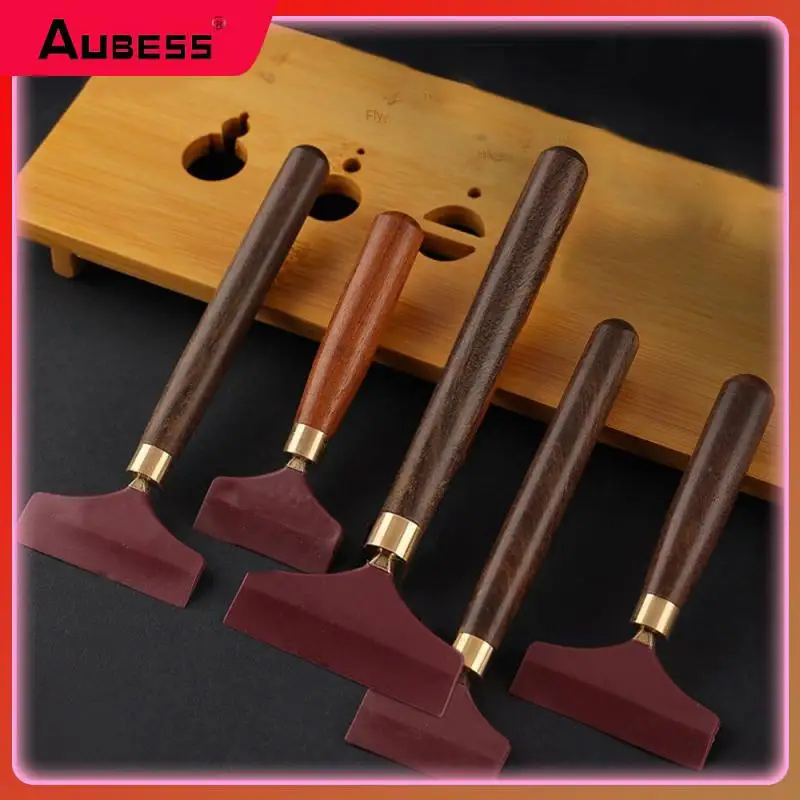 

Стеклоочиститель с древесной текстурой, умеренная мягкость и твердость, ручка подключена к деревянному скребку для чайного подноса из сплава, скребок для чая