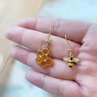 cool quirky bee earrings with yellow honey comb mismatch earrings on 14k gold plated hooks handmade drop dangle earrings