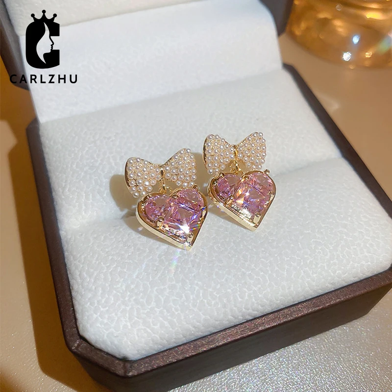 

Новинка 2022, милые серьги-подвески в форме сердца с жемчугом и бантом, Необычные роскошные аксессуары для женщин и девушек