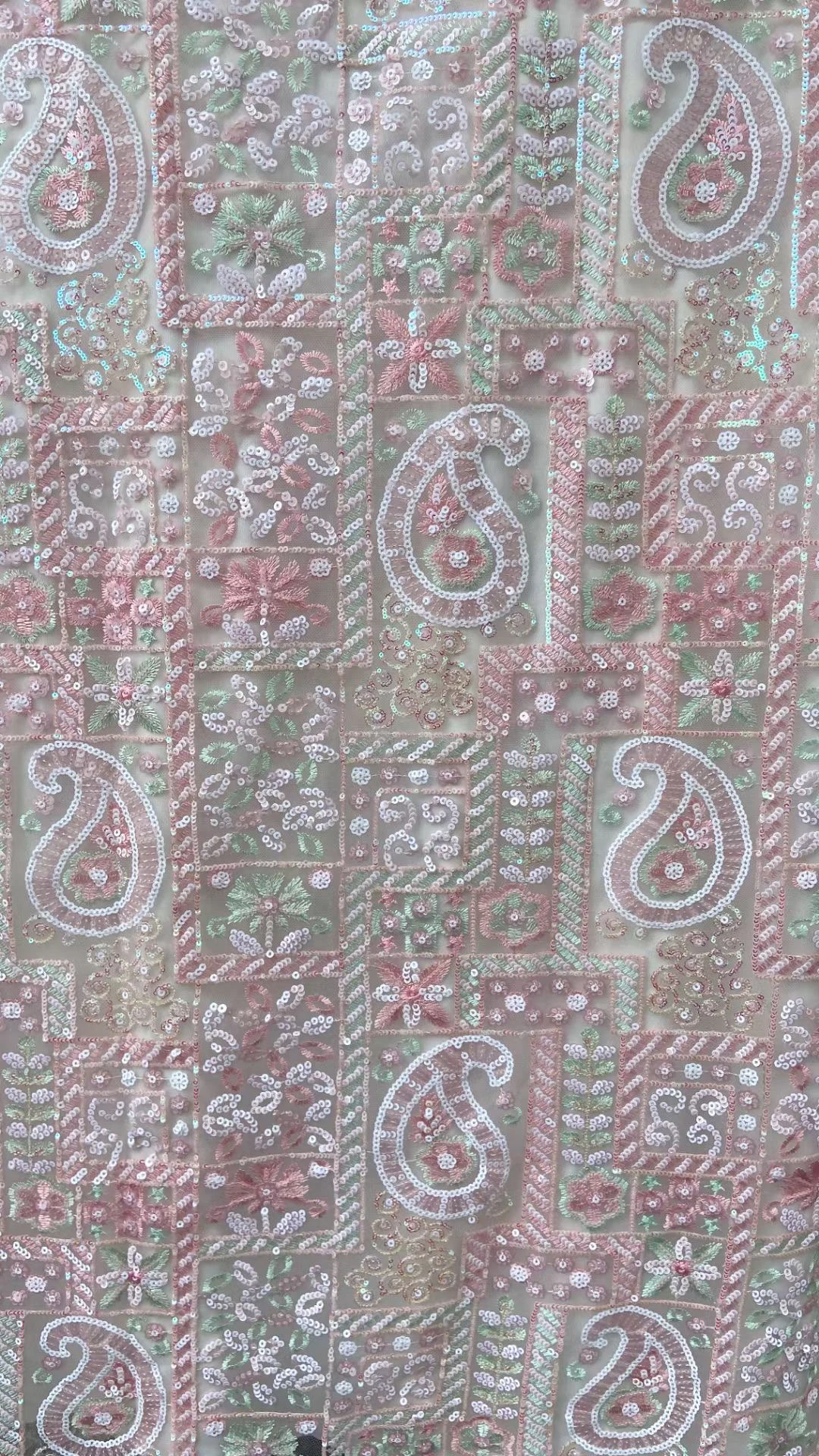 

The latest fashions are African lace fabrics and French lace dresses full of pink sequins