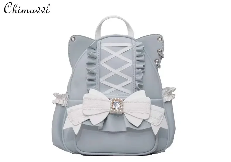 Женский рюкзак на молнии в японском стиле с кружевными вставками и бантом виде