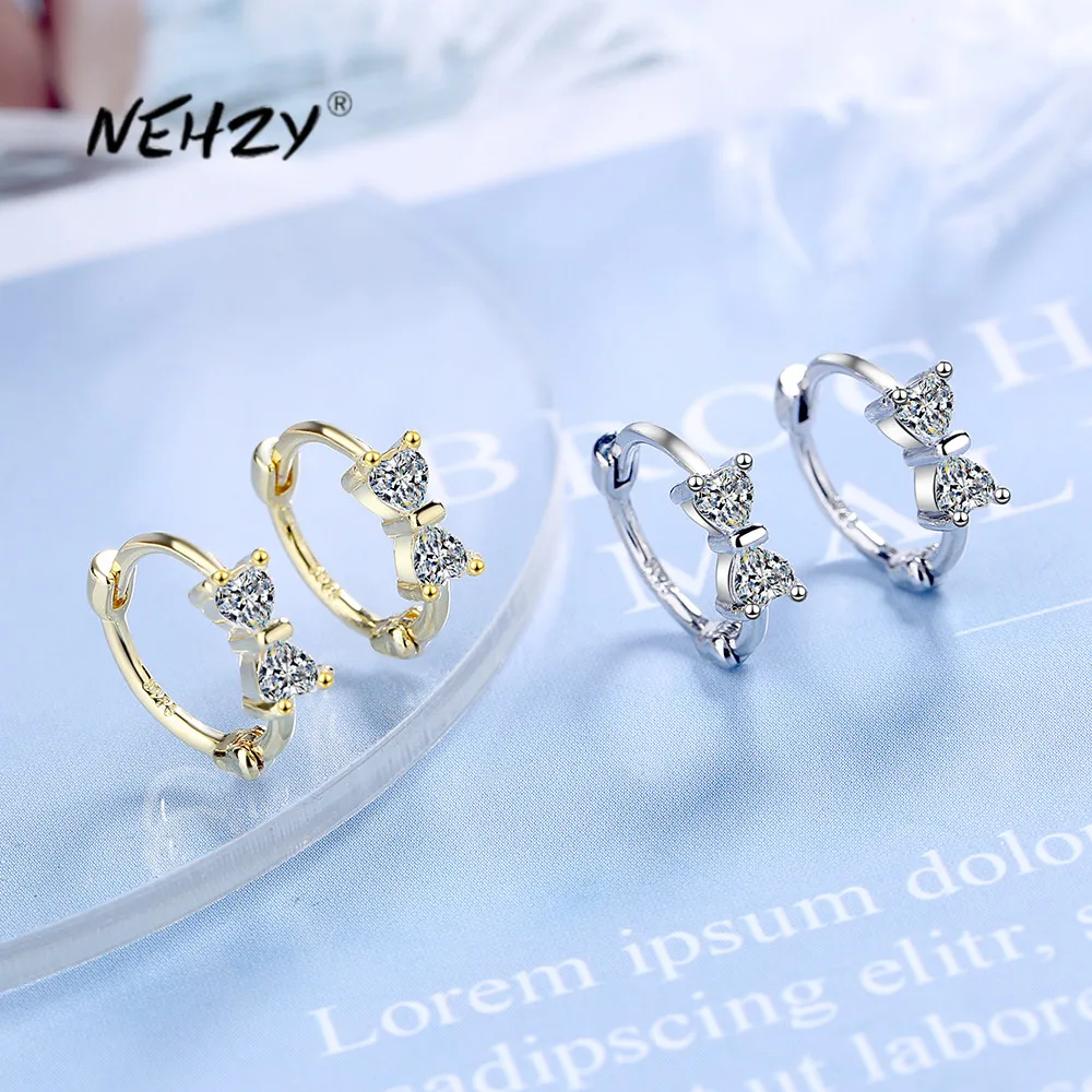 

Женские серебряные сережки-бантики с кристаллами и цирконами