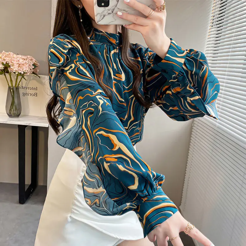 

Long -sleeved chiffon shirt Female spring and autumn design niche new model 2022 new fashion ruffle edge edge unique blouse top