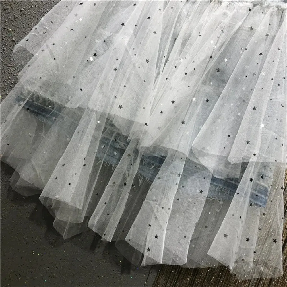 Женская короткая джинсовая юбка асимметричная сетчатая с блестками и бахромой