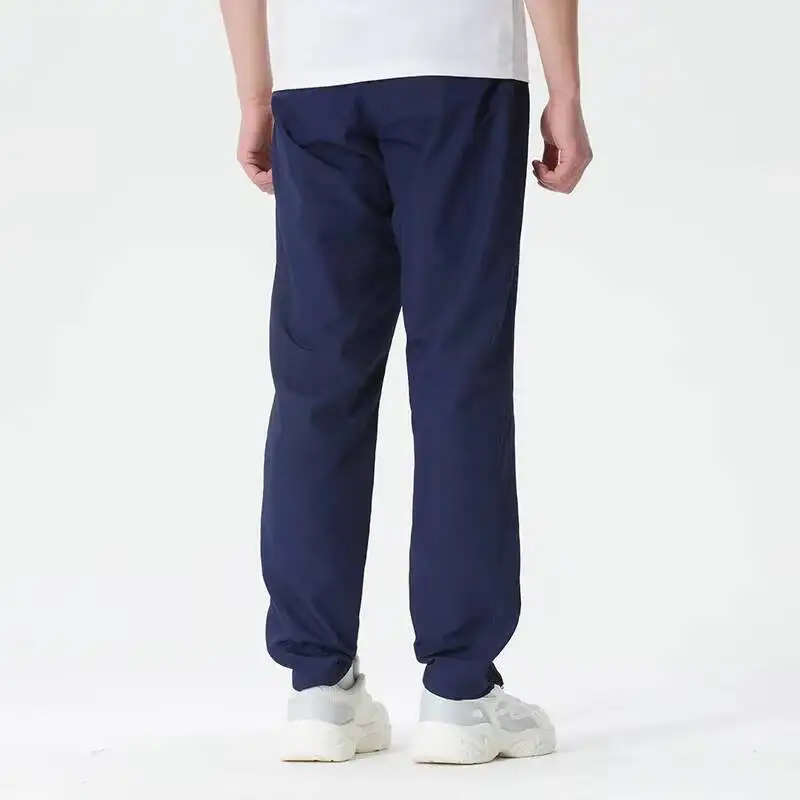 Фото Новые прямые брюки Under Armour Navy Slim для женщин и мужчин из гладкой ткани, повседневные брюки, универсальные деловые брюки для повседневной носки 1390150-410 №4