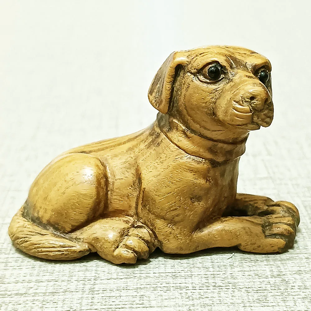 

Деревянная статуэтка собаки из палисандра