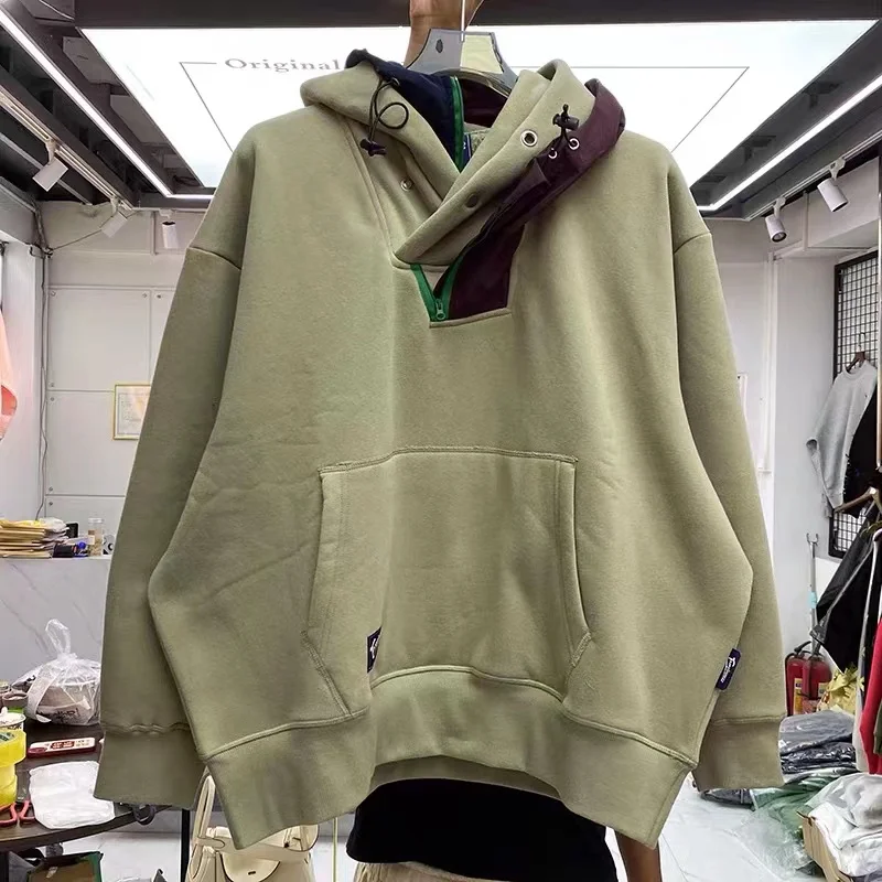 Irregularly stitched solid color functional hoodie