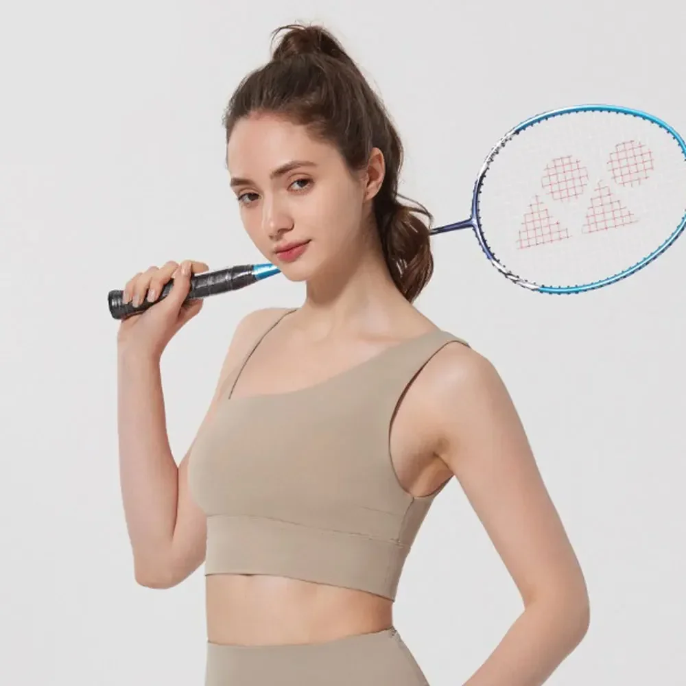 Спортивный бюстгальтер с асимметричными бретельками телесного цвета