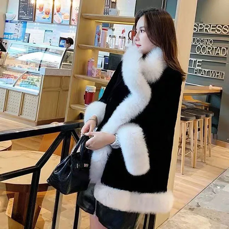 2022 autumn and winter new loose imitation fur black and white stitching warm air fashion all-match cape coat women