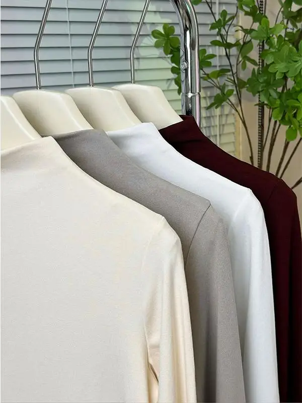 Нижняя рубашка абрикосового цвета с полувысоким воротником и длинными рукавами