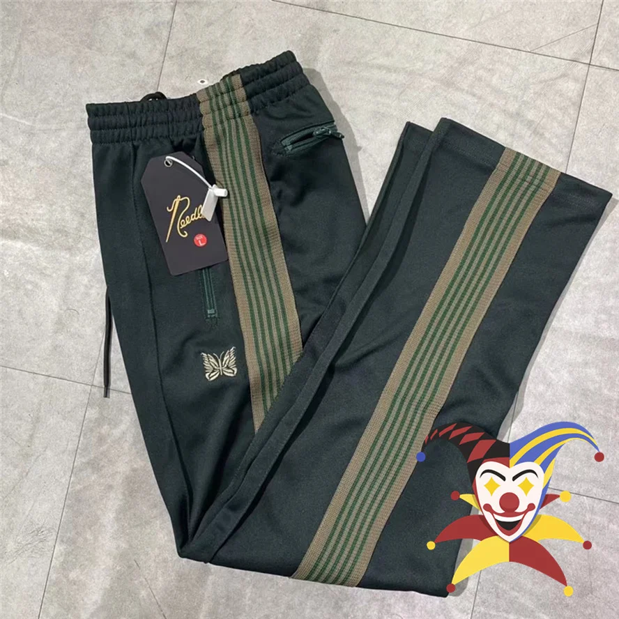 Брюки мужские/женские черно-зеленые с вышивкой и логотипом бабочка |