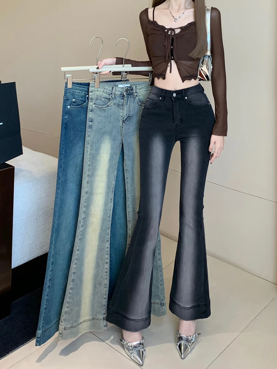 

Real time photo of washed black retro jeans for women in autumn with floor mopping micro speakers, high waisted slim fitting and