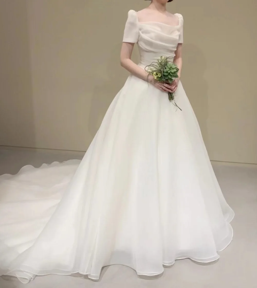 

2022 New Design 웨딩드레스 Square Neck Court Train Wedding Dress Short Sleeves Organza A-Line Backless Korean Simple Bridal Gowns