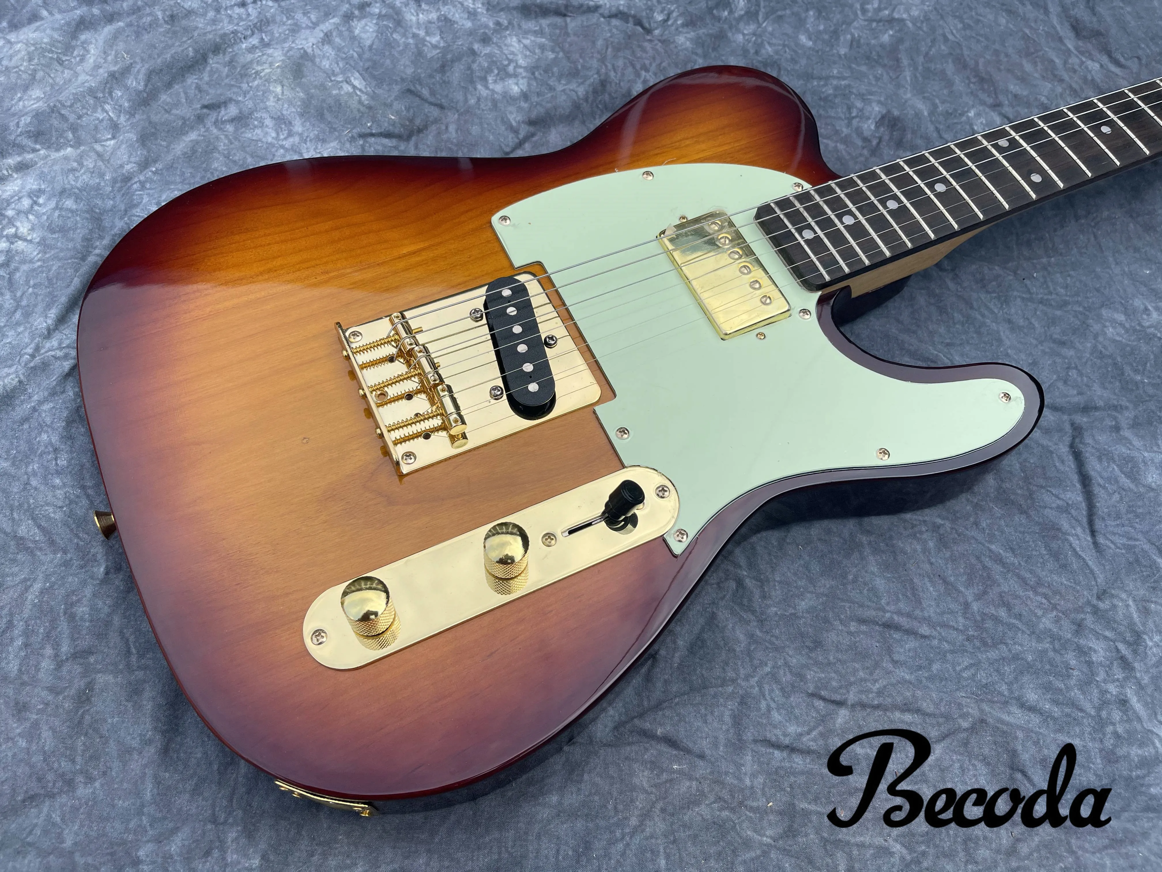 

China Becoda New style electric guitar,T Lguitar maple wood neck Alder wood body can customized.